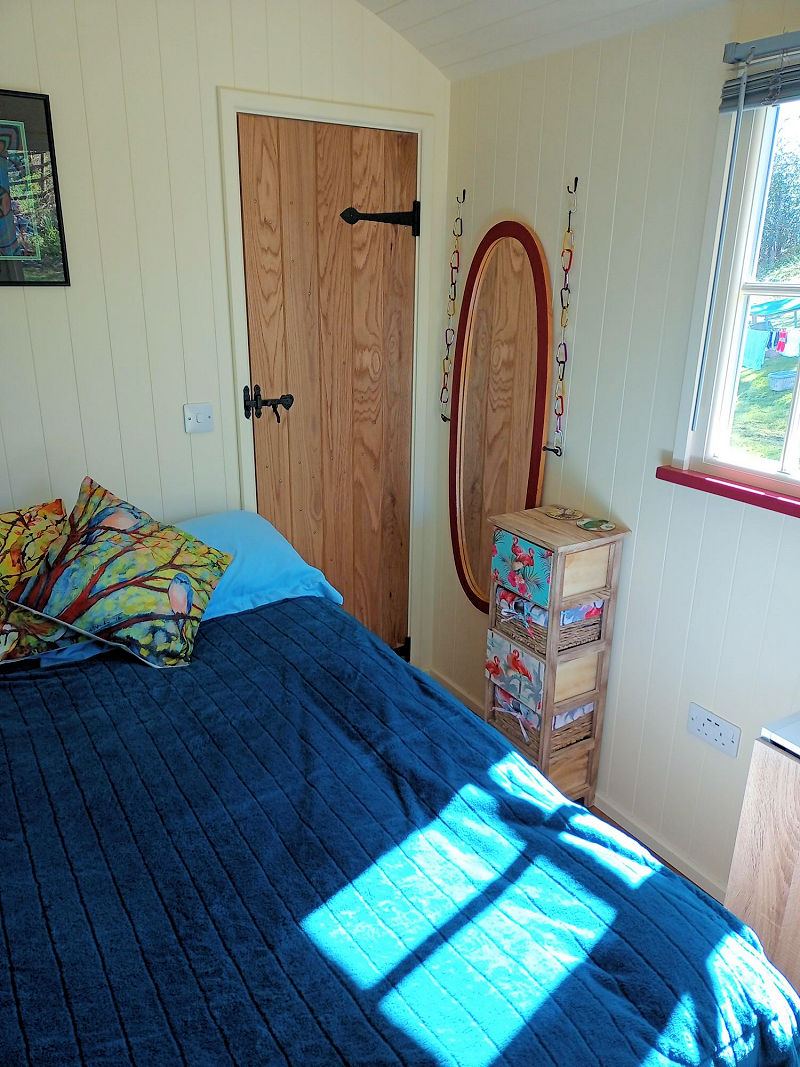 The Hide shepherd's hut, bed