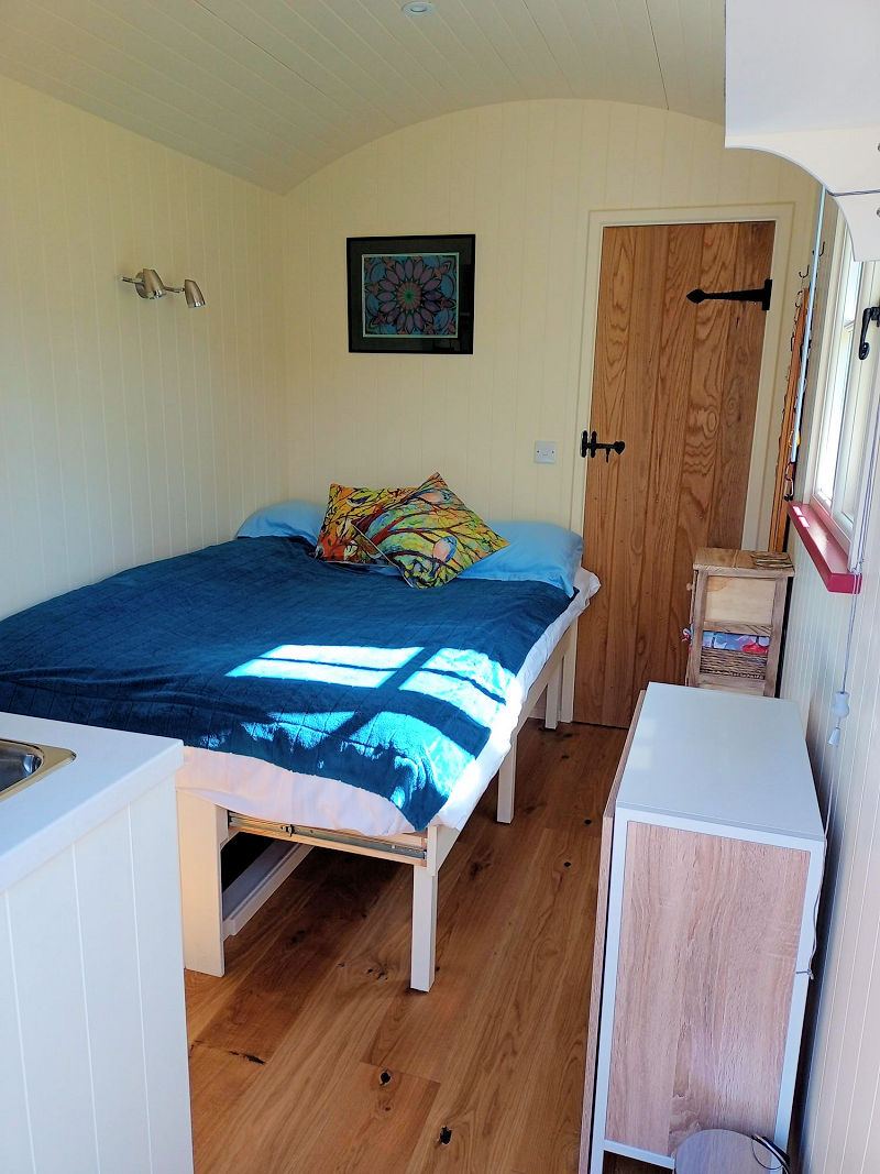 The Hide shepherd's hut, bed